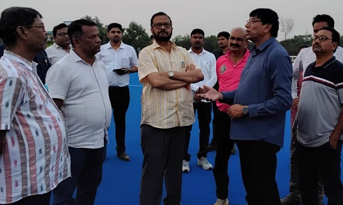 Minister Pujari Reviews Progress at Hockey Stadium