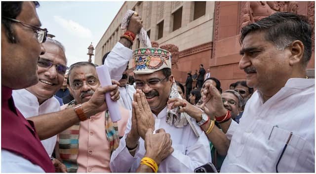 Dharmendra Pradhan Receives Warm Reception in Parliament Amid Controversy